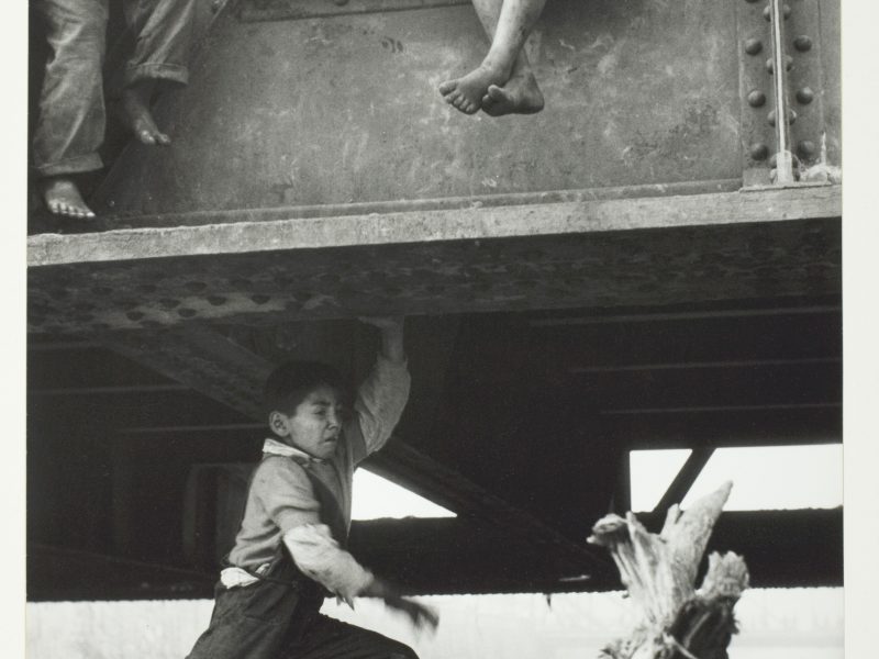 Sergio Larráin, Vagabond Boys Playing on Bridge, Santiago, Chile, 1957