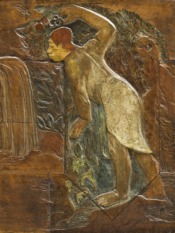 This is a flat wood carving depicting a male figure standing in a forested landscape. He leans forward, steadying himself against an overhanging branch, as he looks forth at what appears to be a waterfal.